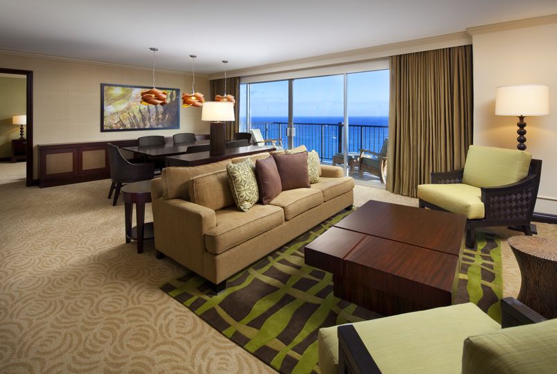 The living room in an Executive Ocean Suite